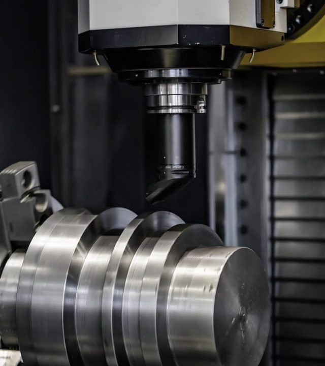 Metalworking CNC milling machine. Cutting metal modern processing technology. Small depth of field. Warning - authentic shooting in challenging conditions. A little bit grain and maybe blurred.